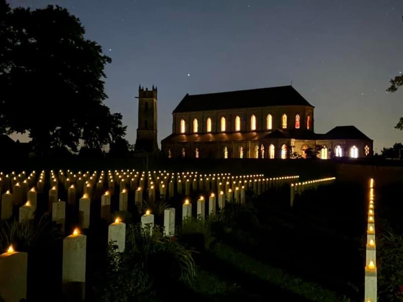 Ranville War Cemetery illuminated by candles